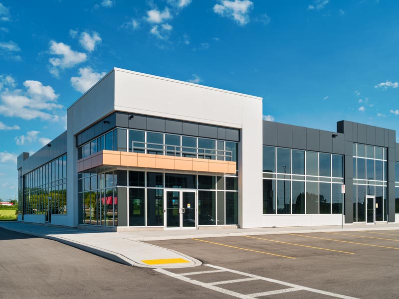 Large commercial office building with a parking lot located in Atlanta, GA