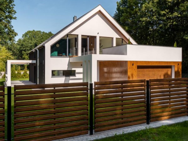 Contemporary home featuring a wooden fence and grass, with Dixon Painting in Atlanta, GA