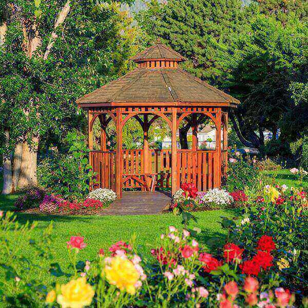 A pergola structure nestled in a park filled with colorful flowers in Atlanta, GA