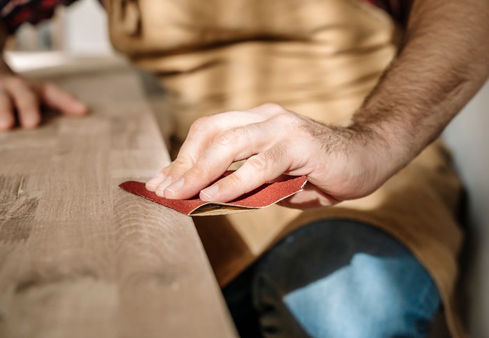 Dixon Painting's expert sanding the wood in Atlanta and Marietta, GA