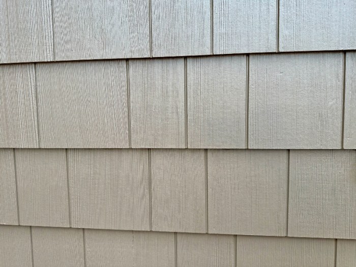 Fiber cement siding exterior wall with textured panels on a home in Atlanta, GA