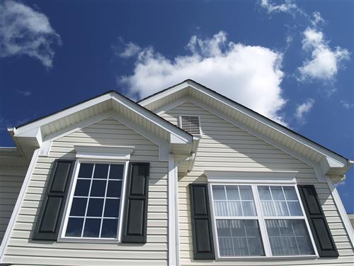 White fiber cement siding house with black shutters, situated in Marietta, GA
